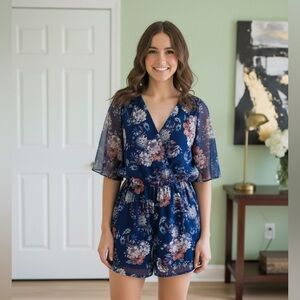 As U Wish Blue Floral Romper Size Small flowy sleeves V neck waist tie